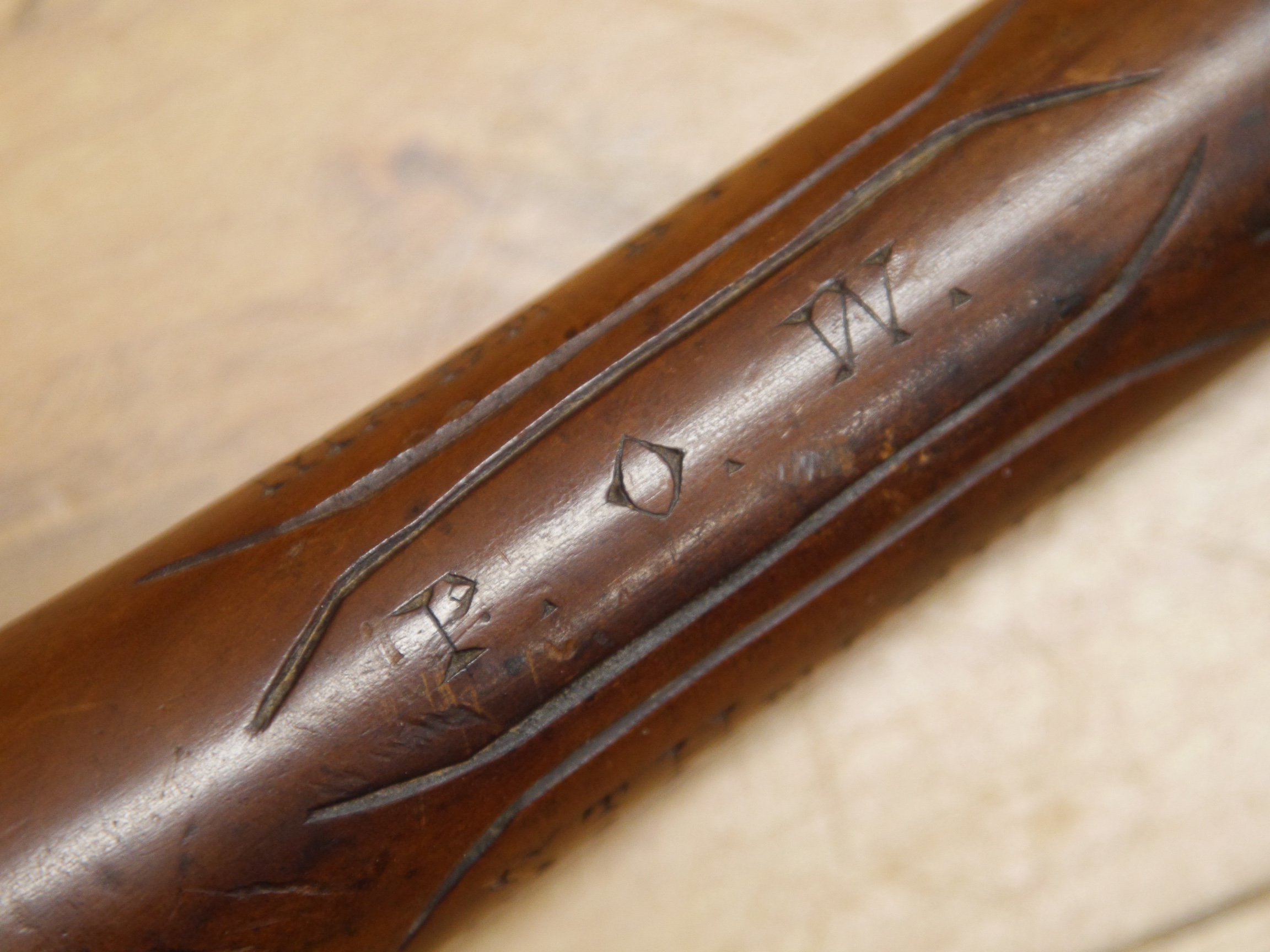 A carved lignum vitae prisoner of war walking stick/fid inscribed, ‘St Helena, 1901, made by, POW’, 90cm in length. Condition - fair to good